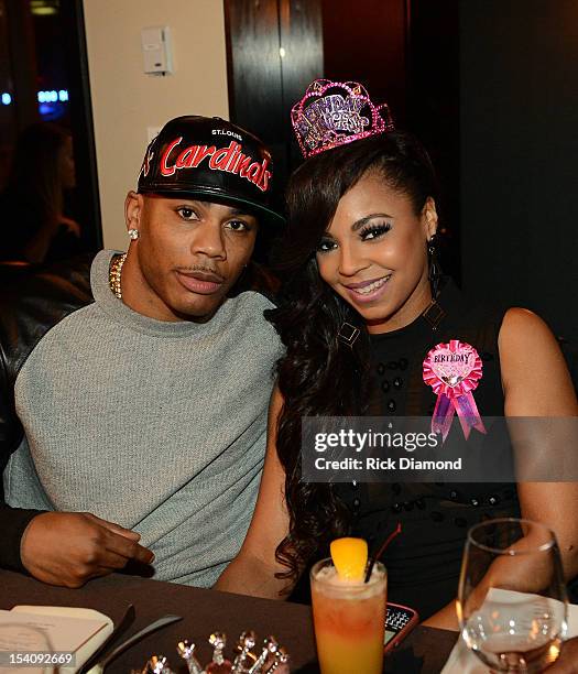 Recording Artists Nelly and Ashanti during Ashanti's surprise birthday dinner hosted by Nelly at STK on October 13, 2012 in Atlanta, Georgia.