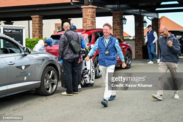 Brad Faxon smiles and cheers on Rory McIlroy following his victory in the final round of the Genesis Scottish Open at The Renaissance Club on July...