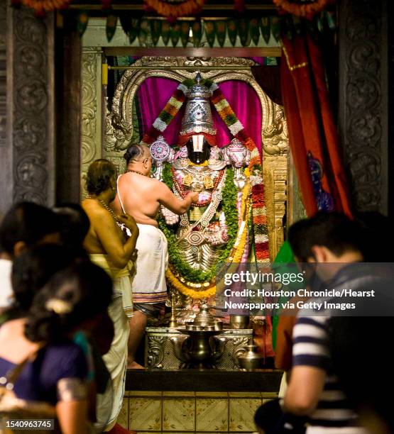 Priests give their offerings in the Temple for the deity Lakshmi during the Diwali ceremony during the Grand Deepavali Celebration Saturday, Oct. 10...