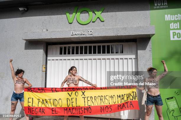 Activists of feminist group FEMEN with their bare chests painted with messages against gender-based murder of women are seen protesting in front of...