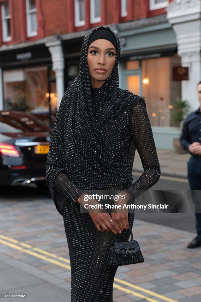 Ikram Abdi-Omar attends the British Vogue x self-portrait Summer
