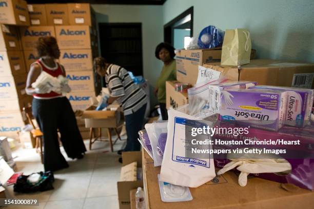 Medical supplies ranging from latex gloves to c-section kits are categorized by the volunteers of Nurses4Haiti Saturday, Jan. 23 in Houston. Sherry...