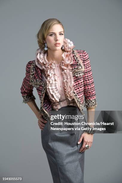 Lindsay Mallia of Page Parkes Models wears Oscar de la Renta's pre-fall 2010 collection pink silk taffeta sleeveless blouse with black threadwork...