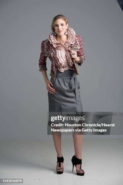 Lindsay Mallia of Page Parkes Models wears Oscar de la Renta's pre-fall 2010 collection pink silk taffeta sleeveless blouse with black threadwork...