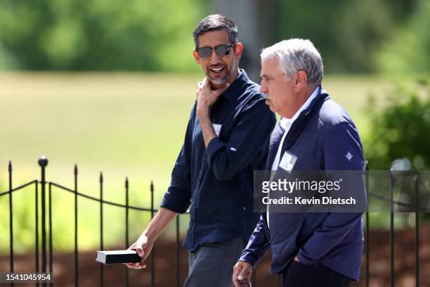 Sundar Pichai, CEO of Alphabet Inc., walks with Tom Friedman, New York Times columnist, during the Allen & Company Sun Valley Conference on July 13,...