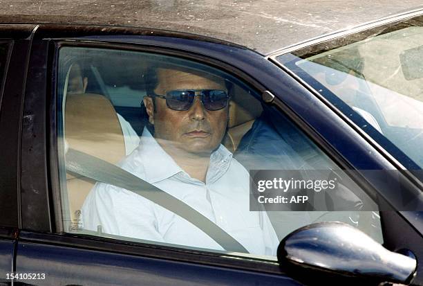 Costa Concordia cruise former captain Francesco Schettino leaves in his car in Meta di Sorrento on October 14, 2012. An Italian court will begin...
