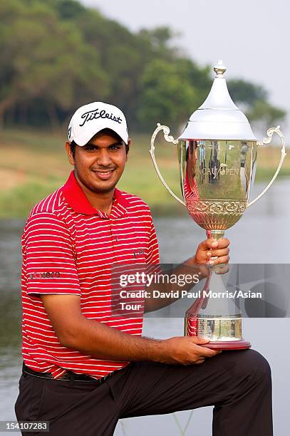 Gaganjeet Bhullar of India poses with the winners trophy after victory the Venetian Macau Open 2012 at the Macau Golf and Country Club on October 14,...