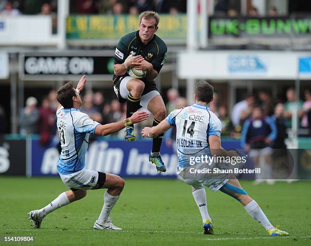 Stephen Myler of Northampton Saints out jumps Tommy Seymour and Peter Murchie of Glasgow Warriors during the Heineken Cup Round 1 match between...
