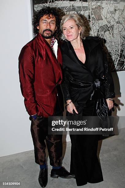 Artist Anselm Kiefer's companion Renate Graf and Haider Ackermann attend the opening of Thaddaeus Ropac's new gallery on October 13, 2012 in Pantin,...