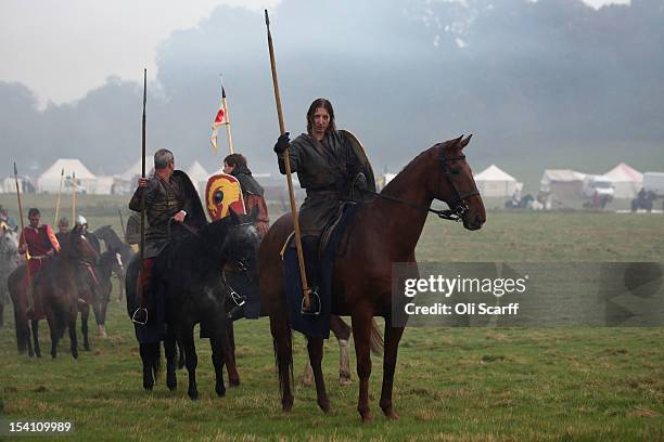 Members of historical re-enactment groups, assuming the role of Norman cavalry, practice before the annual re-enactment of the Battle of Hastings at...