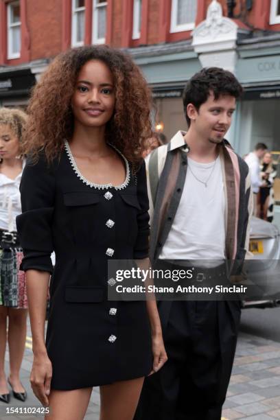 Malaika Firth and Asa Butterfield arrive at the British Vogue x self-portrait Summer Party at Chiltern Firehouse on July 13, 2023 in London, England.