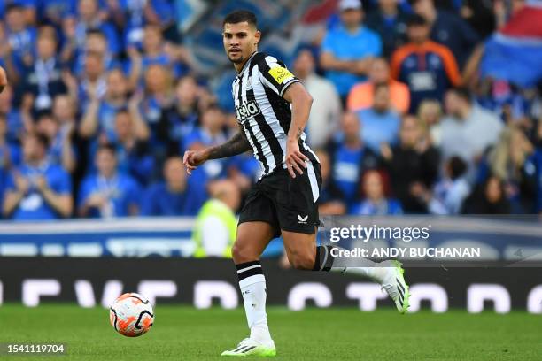 Newcastle United's Brazilian midfielder Bruno Guimaraes passes the ball during the pre-season friendly football match between Rangers and Newcastle...