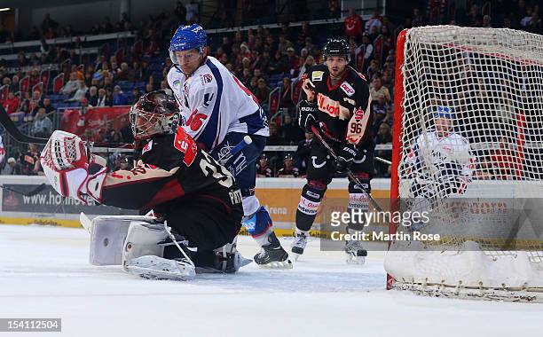Dimitri Paetzold , goaltender of Hannover saves the shot of Yannic Seidenberg of Mannheim during the DEL match between Hannover Scorpions and Aadler...
