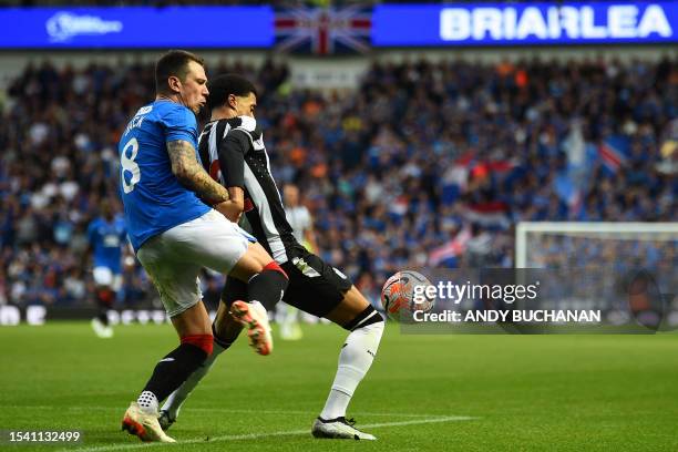 Rangers' Scottish midfielder Ryan Jack vies with Newcastle United's English-born Northern Irish defender Jamal Lewis during the pre-season friendly...