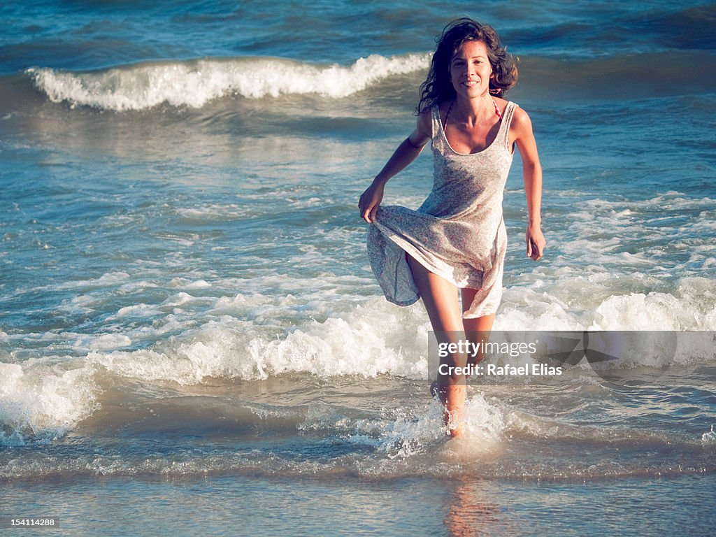Woman emerging from sea