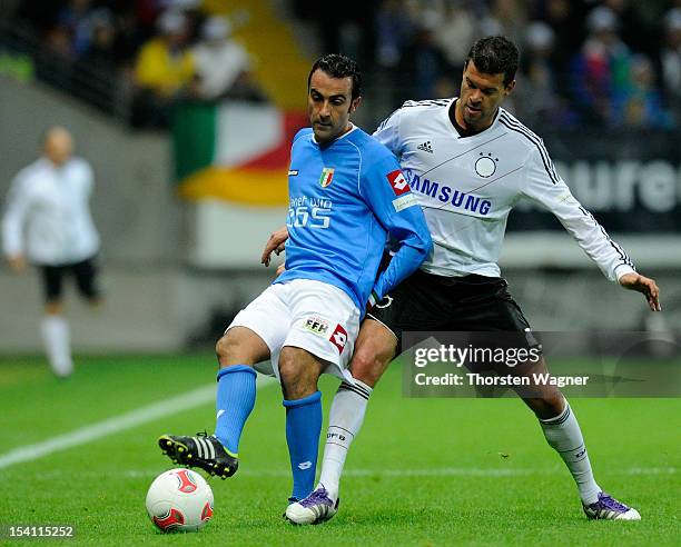 Michael Ballack of Germany battles for the ball with Marco Ballotta of Italy during the century match between Germany and Italy at Commerzbank Arena...