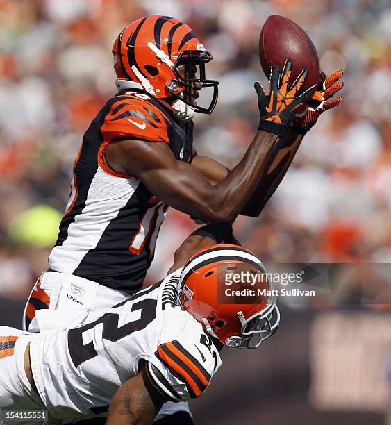 Wide receiver A.J. Green of the Cincinnati Bengals makes a catch over defensive back Buster Skrine of the Cleveland Browns at Cleveland Browns...