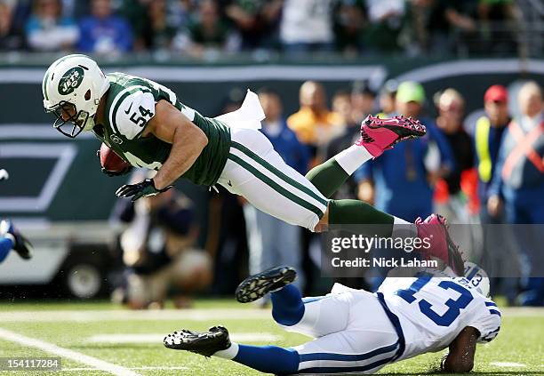Nick Bellore of the New York Jets is tackled by T.Y. Hilton of the Indianapolis Colts at MetLife Stadium on October 14, 2012 in East Rutherford, New...