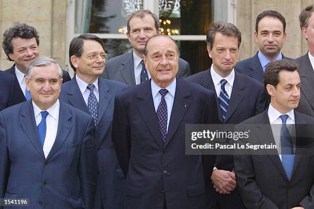 French President Jacques Chirac and newly appointed French Prime Minister Jean-Pierre Raffarin stand with French Cabinet Ministers for a family photo...