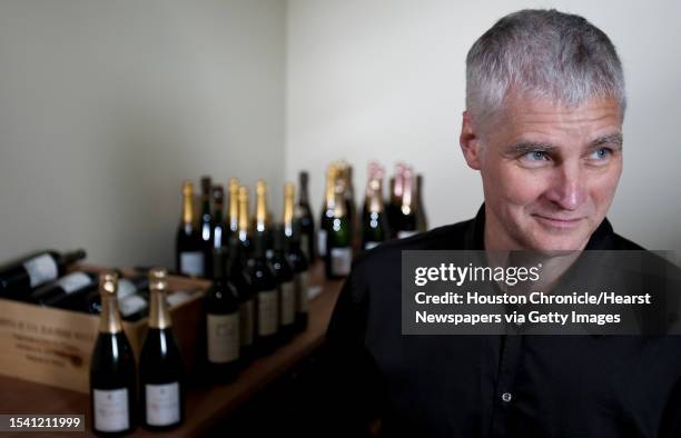 Jim Jistel stands in his personal wine and champaign locker, which is kept at 55 degrees Tuesday, Aug. 31 in Nos Cave Vin wine club in Houston.