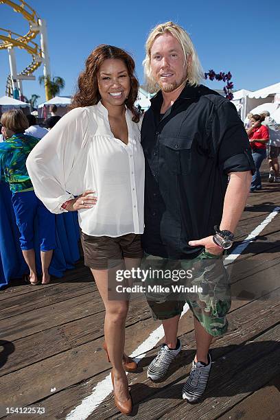 Actress Raquel Bell and athlete Breaux Greer pose during the Special Olympics Southern California 14th Annual Pier Del Sol Event at Santa Monica Pier...