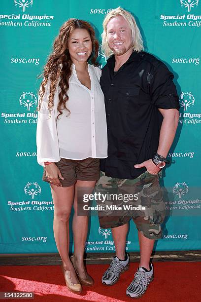 Actress Raquel Bell and athlete Breaux Greer pose during the Special Olympics Southern California 14th Annual Pier Del Sol Event at Santa Monica Pier...