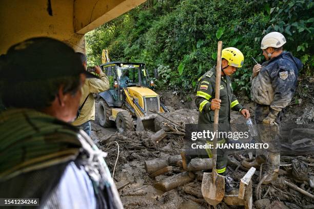 Members of the rescuing team work at the site of a landslide in the Quetame municipality, Cundinamarca department, Colombia, on July 18, 2023. Rescue...