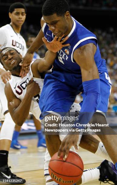 Connecticut guard Kemba Walker fouls Kentucky forward Terrence Jones during the second half of the NCAA National Semifinals at Reliant Stadium on...