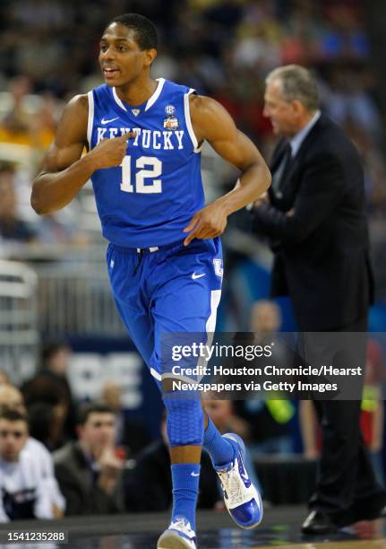 Kentucky guard Brandon Knight reacts after making a three point basket during the first half of their match-up with Connecticut in the NCAA National...