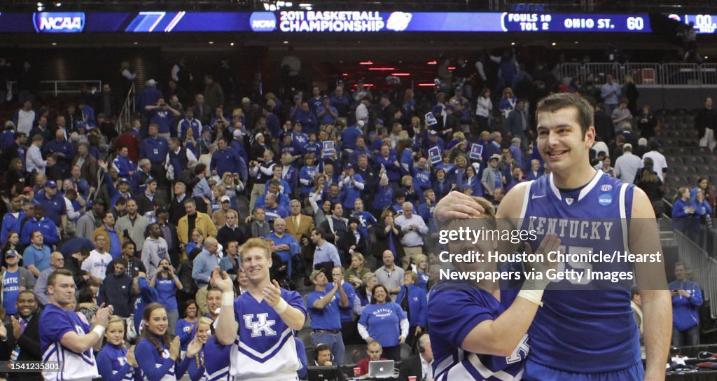 University of Kentucky forward Josh Harrellson is congratulated by a  News Photo - Getty Images