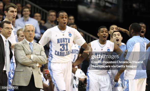 University of North Carolina forward John Henson and the starters support the bench players who got some playing time against Marquette University in...