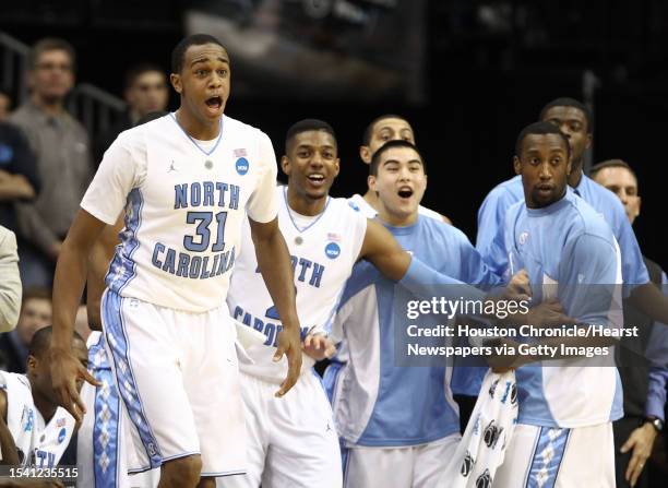 University of North Carolina forward John Henson and the starters support the bench players who got some playing time against Marquette University in...