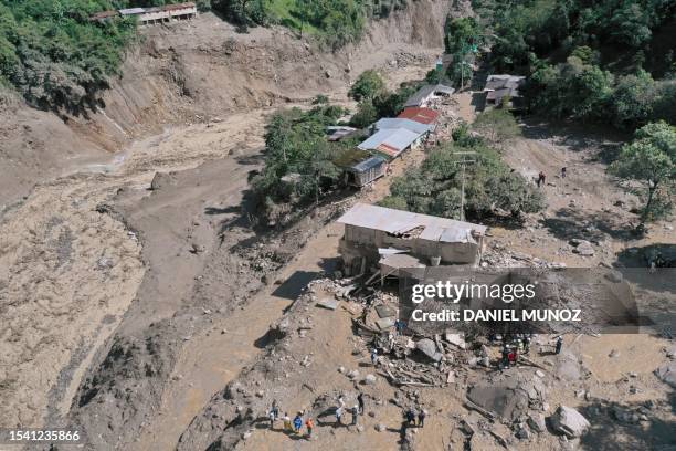 Aerial view of the site of a landslide in the Quetame municipality, Cundinamarca department, Colombia, on July 18, 2023. Rescue teams with drones...