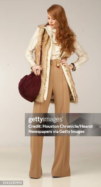 Vicki McCarty of Page.713 wears a Rachel Zoe pants, $375, fur vest, $225, and shirt, $275; with a red pendant necklace, $195, bangles, $250 each,...