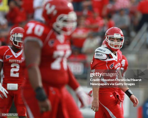 University of Houston quarterback Case Keenum walks off the field after being scked during the fourth quarter of the 2011 Conference USA Football...