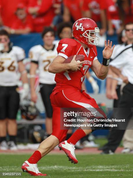 University of Houston quarterback Case Keenum scrambles for a first down during the first quarter of the 2011 Conference USA Football Championship...