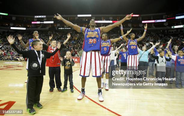 Owen Lehman, left of Waller, dances YMCA with Hi-Lite Bruton during a time out of the Globetrotters game against Global Select, Sunday, Jan. 29 in...