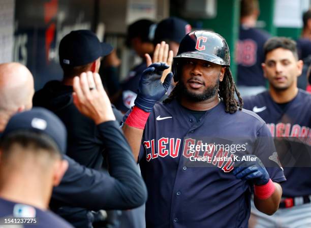 Josh Bell of the Cleveland Guardians celebrates after hitting a two-run home run in the third inning against the Pittsburgh Pirates during...