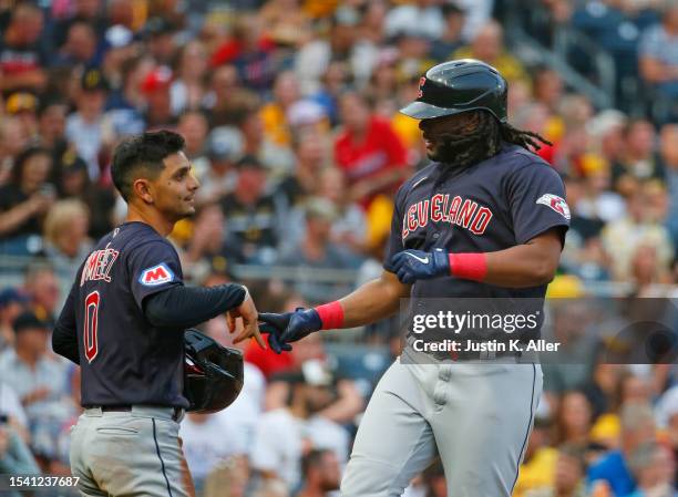 Josh Bell of the Cleveland Guardians celebrates after hitting a two-run home run in the third inning against the Pittsburgh Pirates during...