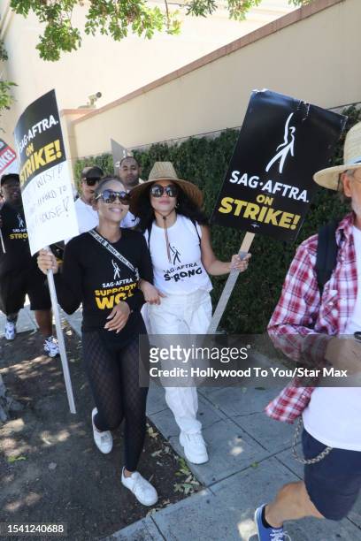 Alexandra Shipp and Vanessa Hudgens walk the picket line in support of the SAG-AFTRA and WGA strike on July 18, 2023 in Los Angeles, California.