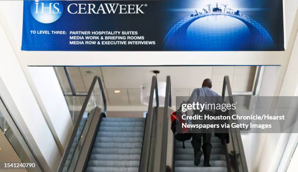 Scattered IHS CeraWeek 2013' attendants and staff walk about during the pre-conference day, Monday, March 4 in the Americas Hilton Houston in Houston.