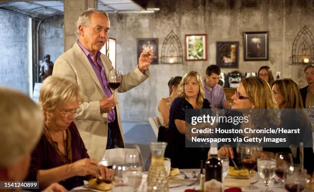 Raymond Haak welcomes his guests for diner served by his wineries' chef and served in the basement where some of the wine is aged, Friday, April 5 in...