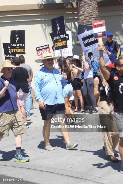 Andy Richter walks the picket line in support of the SAG-AFTRA and WGA strike on July 18, 2023 in Los Angeles, California.