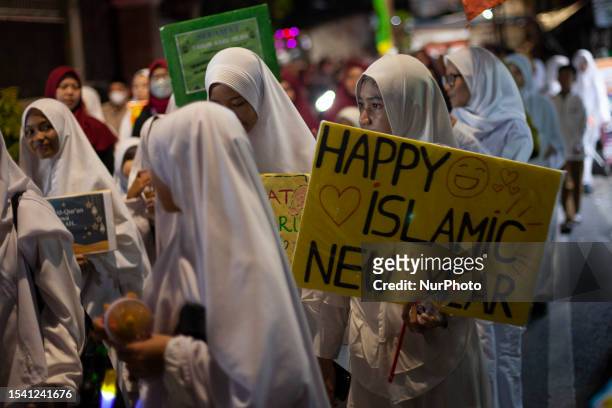 Hundreds of muslims take part during torch parade to celebrate the Islamic New Year, 1st Muharram, 1445 Hijriya in Jakarta, on July 18, 2023.