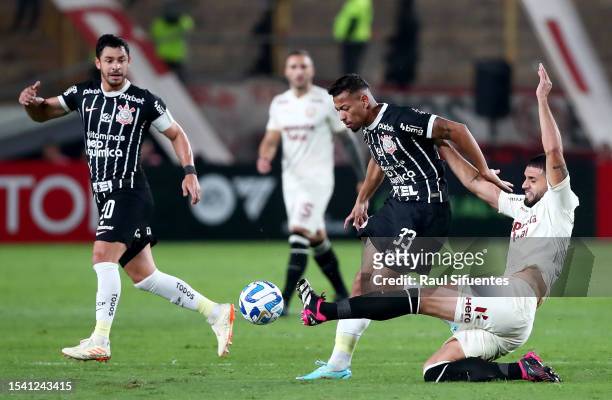 Ruan Oliveira of Corinthians battles for the ball with Matias Di Benedetto of Universitario during the second leg of the round of 32 playoff match...