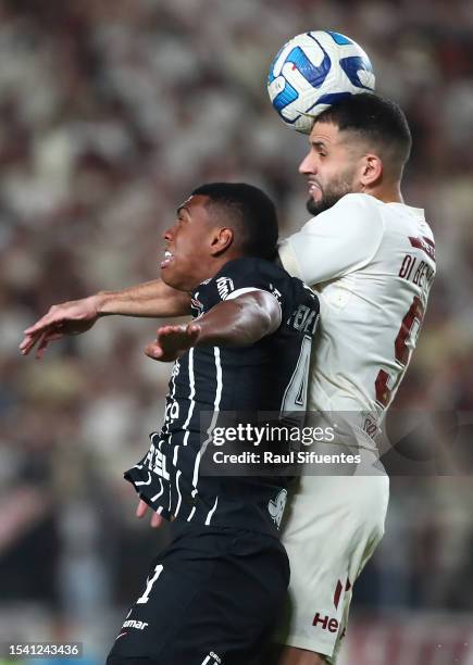 Matias Di Benedetto of Universitario battles for the ball with Felipe Augusto of Corinthians during the second leg of the round of 32 playoff match...