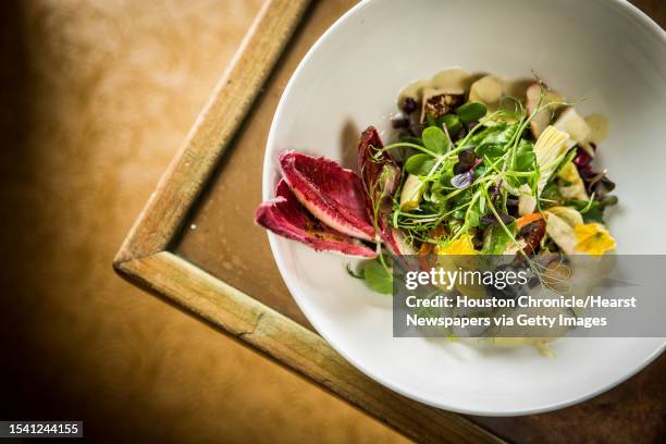 Hugo's Ensalada de Alcachofa, mixed greens, baby artichoke, red endive, quest fresco, avocado, photographed, Monday, July 10 in Houston.