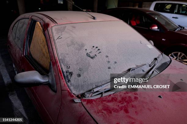 An abandoned vehicle is seen in the parking lot of Ponte City, also known as Ponte Tower, in Berea, Johannesburg on June 8, 2023. The...