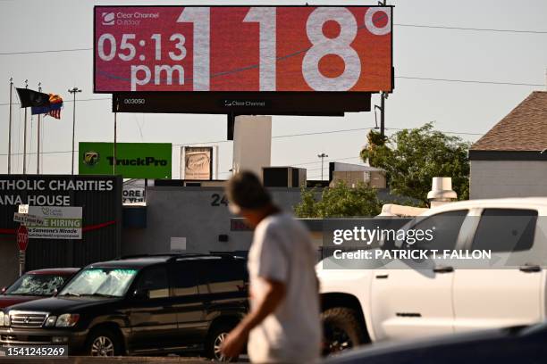 Billboard displays a temperature of 118 degrees Fahrenheit during a record heat wave in Phoenix, Arizona on July 18, 2023. Swaths of the United...