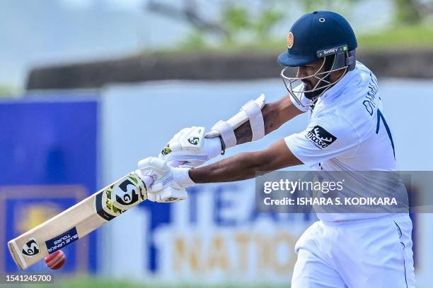 Sri Lanka's captain Dimuth Karunaratne plays a shot during the fourth day of the first cricket Test match between Sri Lanka and Pakistan at the Galle...